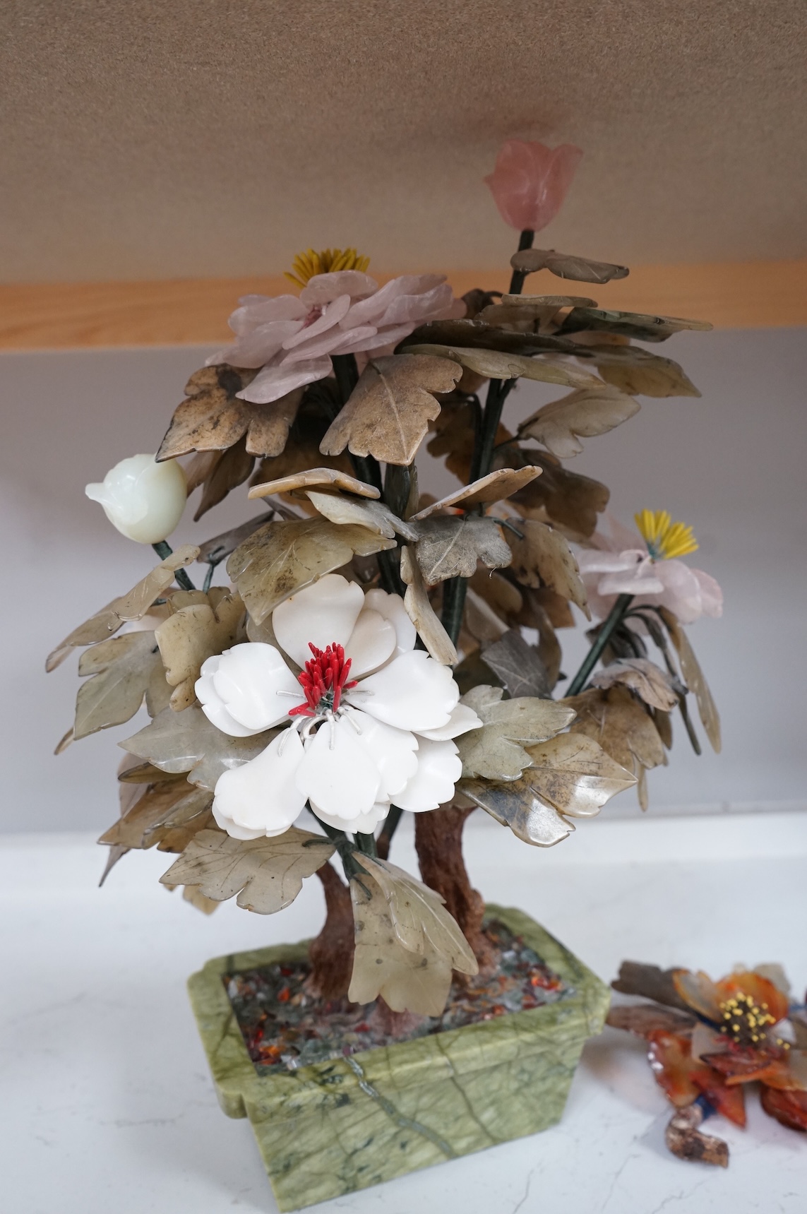 A Chinese carved hardstone and semi-precious stone plant, 44cm high